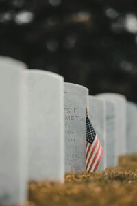 American flag placed at a military cemetery with tombstones in Chattanooga, TN.